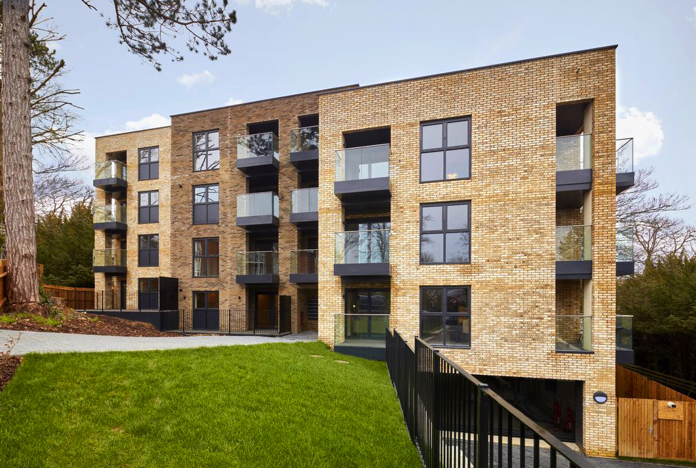 Glass balconies with a stainless steel handrail and aluminium drip tray system